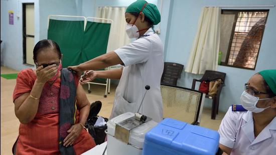 A senior citizen gets her first shot of Covid-19 vaccine at Rajawadi Hospital in Mumbai on Thursday. (Satish Bate/HT Photo) A senior citizen gets her first shot of Covid-19 vaccine at Rajawadi Hospital in Mumbai on Thursday. (Satish Bate/HT Photo)
