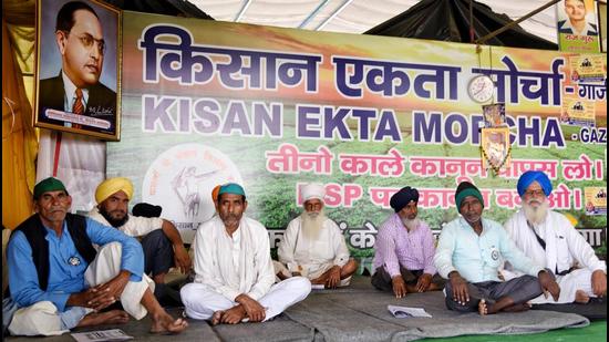 Farmers at Ghazipur border, during the ongoing protest against the new farms laws, in New Delhi on Wednesday. (ANI)
