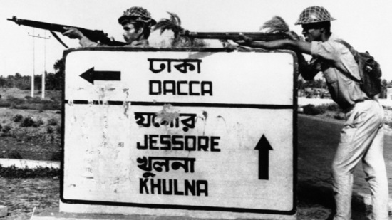 Indian troops stand guard at a road crossing to Dacca after capturing Jessore town, in East Pakistan, on December 8, 1971. The military rejected the results of 1970 national polls, leading to a civil disobedience movement and more calls for independence.