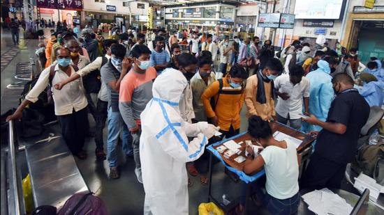 Passengers stand in a queue for the Covid-19 test, at Chhatrapati Shivaji Maharaj Terminus in Mumbai on Wednesday. (ANI)