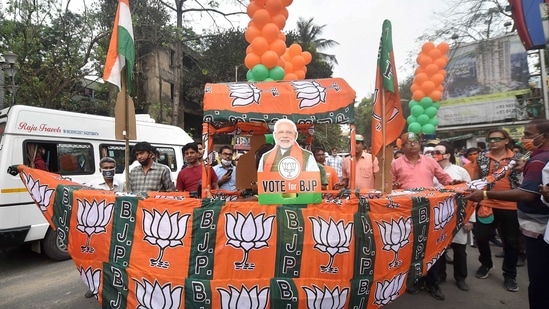 BJP supporters of BJP candidate from Tollygunge constituency Babul Supriyo during his election campaign ahead of state assembly polls, in Kolkata. (PTI) BJP supporters of BJP candidate from Tollygunge constituency Babul Supriyo during his election campaign ahead of state assembly polls, in Kolkata. (PTI)