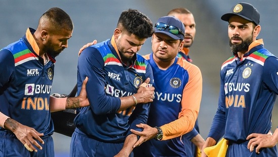 Indian cricketer Shreyas Iyer being attended by teammates after he was injured during the first One Day International cricket match between India and England at Maharashtra Cricket Association Stadium, in Pune, (PTI) Indian cricketer Shreyas Iyer being attended by teammates after he was injured during the first One Day International cricket match between India and England at Maharashtra Cricket Association Stadium, in Pune, (PTI)