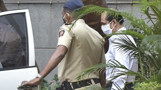 Mumbai: Police officer Sachin Vaze being taken to a court by National Investigation Agency (NIA) for a hearing in connection with a probe into the recovery of explosives from a car parked near industrialist Mukesh Ambani's house, in Mumbai, Thursday, March 25, 2021. (PTI)