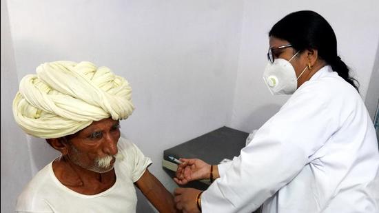 A senior citizen gets his Covid-19 vaccine shot at a government hospital in a village near Ajmer, Rajasthan. (File photo)