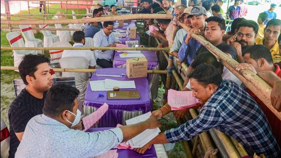 Drivers assigned for election duty, collect their documents before leaving for their respective polling booths ahead of the first phase of Assam assembly polls in Dibrugarh on Thursday. (PTI PHOTO.) Drivers assigned for election duty, collect their documents before leaving for their respective polling booths ahead of the first phase of Assam assembly polls in Dibrugarh on Thursday. (PTI PHOTO.)
