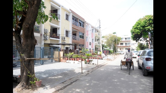 Barricades installed outside houses in Sector 27, Chandigarh, after the area was declared a containment zone on Wednesday. (Ravi Kumar/HT)