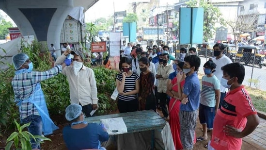 People being screened as they wait to give swab samples for Covid-19 tests at GB road in Thane on Tuesday, March 23. (Photo by Praful Gangurde / HT Photo) People being screened as they wait to give swab samples for Covid-19 tests at GB road in Thane on Tuesday, March 23. (Photo by Praful Gangurde / HT Photo)