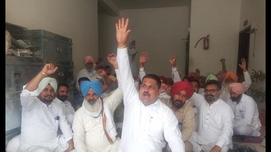 Sarpanches holding a protest outside the Sangrur BDPO’s office on Thursday.