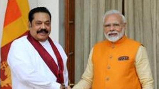 Narendra Modi, India's Prime Minister, right, shakes hands with Mahinda Rajapaksa, Sri Lanka's Prime Minister. (Bloomberg File)
