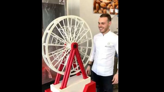 The image shows Amaury Guichon crafting the chocolate Ferris Wheel. (Instagram/@amauryguichon) The image shows Amaury Guichon crafting the chocolate Ferris Wheel. (Instagram/@amauryguichon)