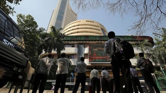 People look at a screen displaying the Sensex results on the facade of the Bombay Stock Exchange (BSE) building in Mumbai, December 11, 2018. REUTERS/Francis Mascarenhas/Files (REUTERS)