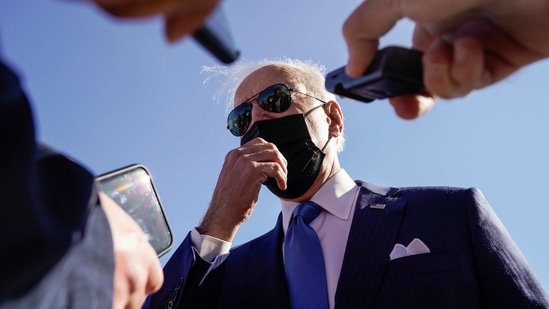 US President Joe Biden talks to reporters as he arrives at New Castle Airport in New Castle, Delaware.(REUTERS)