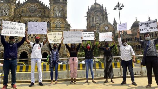 Students hold placards in protest, demanding SSC and HSC online examination or to postpone board exam, at Selfie point outside BMC Head Office at CSMT. (Anshuman Poyrekar/HT Photo)