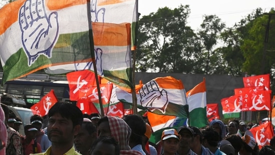 Activists of the Congress and the Left parties participate in the last campaign rally for the United Front candidate before the first phase of West Bengal's state legislative assembly election in Purulia, some 325 km west of Kolkata on March 25, 2021. (AFP)