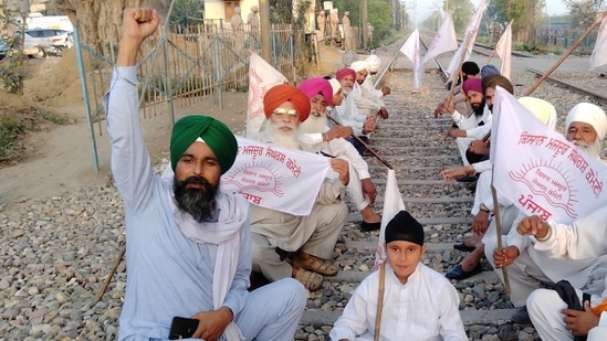 Farmers blocking railway track at Wallah during Bharat Bandh in Amritsar on Friday (Sameer Sehgat/HT)
