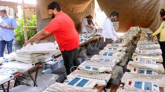 Officials check EVMs at a distribution centre, ahead of local body elections. (PTI/Representative Photo) Officials check EVMs at a distribution centre, ahead of local body elections. (PTI/Representative Photo)