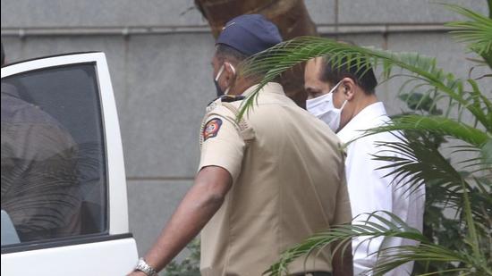 Police officer Sachin Vaze being taken to a court by National Investigation Agency (NIA) for a hearing on Thursday in connection with a probe into the recovery of explosives from a car parked near business tycoon Mukesh Ambani's house in Mumbai. (Bhushan Koyande/ HT Photo)