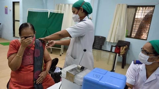 A senior citizen gets her first shot of Covid-19 vaccine at Rajawadi Hospital in Mumbai on Thursday. (Satish Bate/HT Photo)