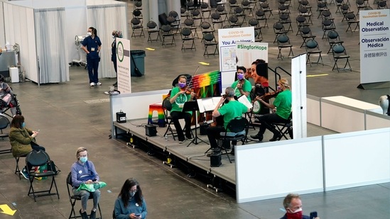 A string quartet performs at the Jacob K. Javits Convention Center vaccination site. (AP) A string quartet performs at the Jacob K. Javits Convention Center vaccination site. (AP)
