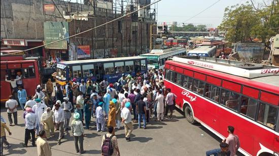 Private bus operators blocking the road in front of the Bathinda bus stand to protest the Punjab government’s order suspending services for an hour every Saturday as a tribute to Covid-19 victims. (Sanjeev Kumar/HT)