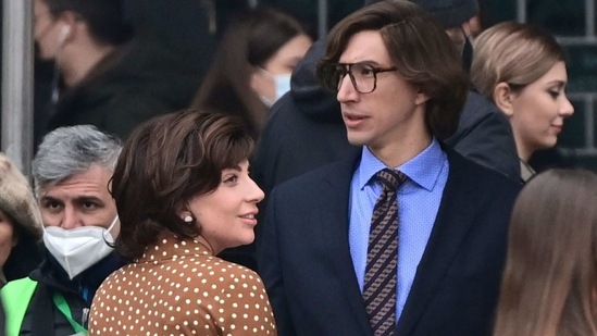 US singer, songwriter and actress Lady Gaga (L) and US actor Adam Driver (R) are pictured on March 11, 2021 on Piazza Duomo in central Milan on the set of the new Ridley Scott movie about the Gucci "Black Widow" Patrizia Reggiani, who was tried and convicted of orchestrating the assassination of her ex-husband and former head of the Gucci fashion house Maurizio Gucci. - "House of Gucci", which stars Lady Gaga, Adam Driver, Al Pacino, Jared Leto, Jack Huston, Reeve Carney and Jeremy Irons, is an upcoming American biographical crime film directed by Ridley Scott, scheduled to be released in the United States on November 24, 2021 by Metro-Goldwyn-Mayer. (AFP) US singer, songwriter and actress Lady Gaga (L) and US actor Adam Driver (R) are pictured on March 11, 2021 on Piazza Duomo in central Milan on the set of the new Ridley Scott movie about the Gucci "Black Widow" Patrizia Reggiani, who was tried and convicted of orchestrating the assassination of her ex-husband and former head of the Gucci fashion house Maurizio Gucci. - "House of Gucci", which stars Lady Gaga, Adam Driver, Al Pacino, Jared Leto, Jack Huston, Reeve Carney and Jeremy Irons, is an upcoming American biographical crime film directed by Ridley Scott, scheduled to be released in the United States on November 24, 2021 by Metro-Goldwyn-Mayer. (AFP)