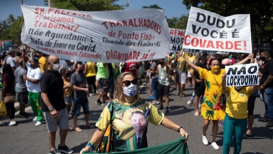 Rio de Janeiro: Supporters of Brazilian President Jair Bolsonaro protest the start of a 10-day period of increased restrictions, which includes Holy Week, to help curb the spread of COVID-19, on Copacabana beach in Rio de Janeiro, Brazil, Friday, March 26, 2021. (AP) Rio de Janeiro: Supporters of Brazilian President Jair Bolsonaro protest the start of a 10-day period of increased restrictions, which includes Holy Week, to help curb the spread of COVID-19, on Copacabana beach in Rio de Janeiro, Brazil, Friday, March 26, 2021. (AP)