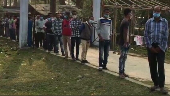 Queue of voters at a booth in Assam's Dibugarh. (Photo: ANI)