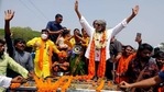 BJP leader Mithun Chakraborty waves to supporters during a road show, in Jhargram on Thursday. (ANI Photo) BJP leader Mithun Chakraborty waves to supporters during a road show, in Jhargram on Thursday. (ANI Photo)