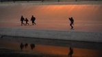 Migrants cross the border into El Paso, Texas, US, as seen from Ciudad Juarez, in Mexico, on March 17. The number of migrants attempting to cross the border is at the highest level since March 2019, with Homeland Security Secretary Alejandro Mayorkas warning that it is on pace to hit a 20-year peak.(Paul Ratje / REUTERS) Migrants cross the border into El Paso, Texas, US, as seen from Ciudad Juarez, in Mexico, on March 17. The number of migrants attempting to cross the border is at the highest level since March 2019, with Homeland Security Secretary Alejandro Mayorkas warning that it is on pace to hit a 20-year peak.(Paul Ratje / REUTERS)