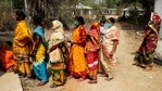 Women stand in a queue to cast their votes during the first phase of elections in Pirakata, West Bengal on Saturday, March 27, 2021.(AP) Women stand in a queue to cast their votes during the first phase of elections in Pirakata, West Bengal on Saturday, March 27, 2021.(AP)