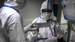 Laboratory technicians wearing protective equipment work on the genome sequencing of the SARS-CoV-2 virus (Covid-19) and its variants.(AFP)
