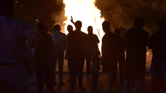 Holika Dahan in Noida on Sunday.(HT Photo)