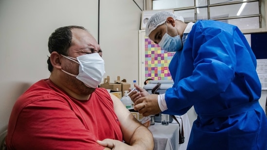A healthcare worker administers a dose of the AstraZeneca Plc Covid-19 vaccines, provided through the Covax initiative, at the Barrio Obrero Public Hospital in Asuncion, Paraguay,(Bloomberg) A healthcare worker administers a dose of the AstraZeneca Plc Covid-19 vaccines, provided through the Covax initiative, at the Barrio Obrero Public Hospital in Asuncion, Paraguay,