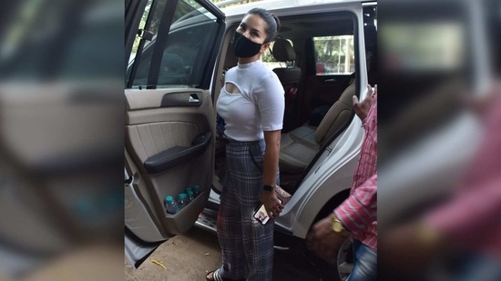 She teamed it with a pair of checkered grey wide-legged pants and added a subtle boardroom touch to the ensemble.(Varinder Chawla)