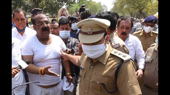Punjab BJP president Ashwani Sharma arguing with a police official during a protest against the Punjab government in Chandigarh on Sunday. Punjab BJP president Ashwani Sharma arguing with a police official during a protest against the Punjab government in Chandigarh on Sunday.