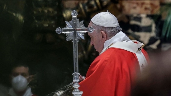 Pope Francis swings a thurible of incense around the altar as he celebrates Palm Sunday mass in The Vatican, amid the coronavirus Covid-19 pandemic. (AFP) Pope Francis swings a thurible of incense around the altar as he celebrates Palm Sunday mass in The Vatican, amid the coronavirus Covid-19 pandemic. (AFP)