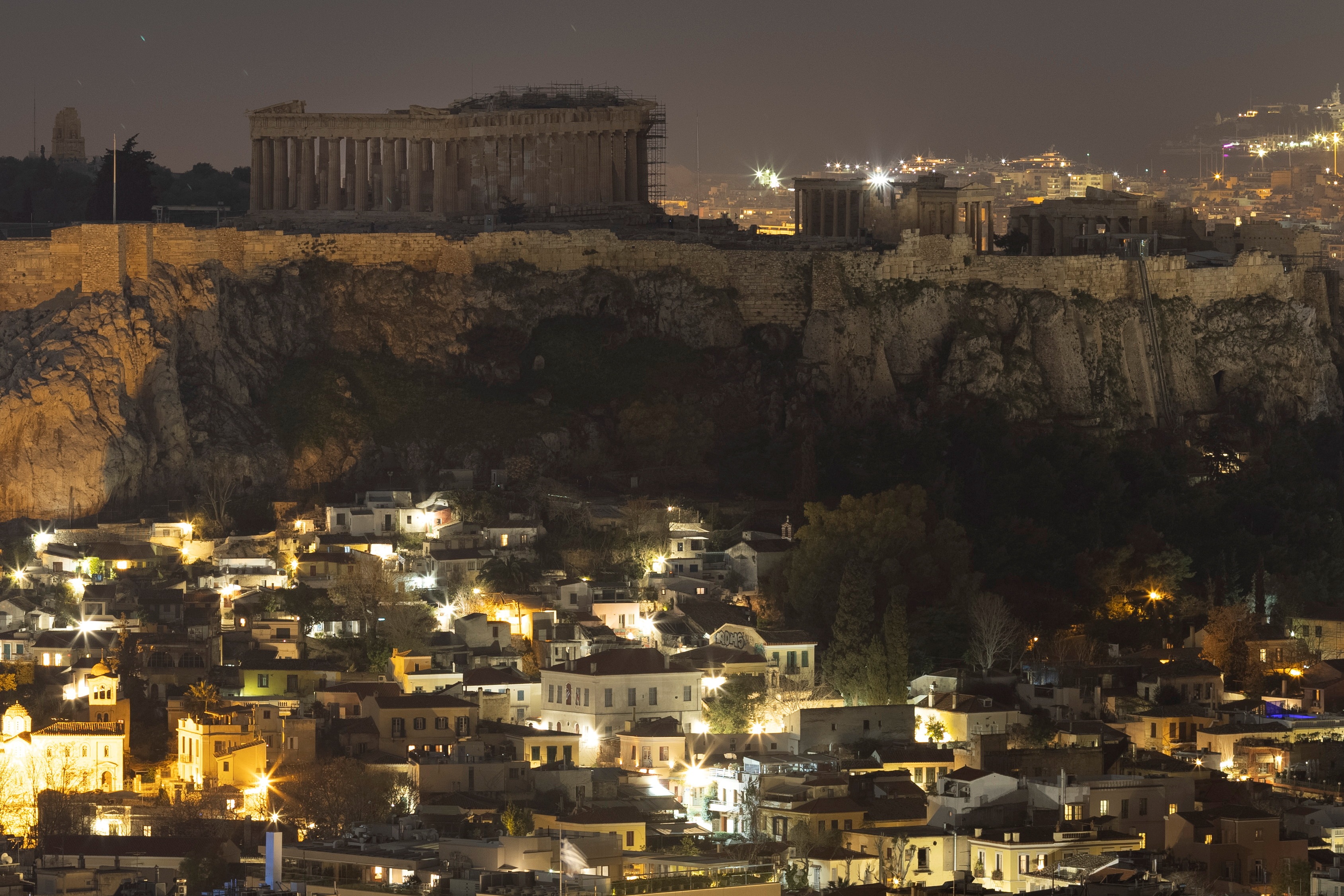 The ancient Parthenon temple is pictured atop the Acropolis hill during Earth Hour in Athens, Greece. (Reuters)