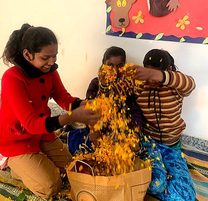 Children at Yatan, an NGO in Gurugram, collect and segregate petals from flowers, which are then used to make Holi colours. Children at Yatan, an NGO in Gurugram, collect and segregate petals from flowers, which are then used to make Holi colours.