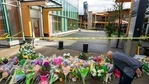 A man lays flowers at a makeshift memorial outside of the Lynn Valley Library in Lynn Valley in North Vancouver, British Columbia, Sunday. (AP Photo ) A man lays flowers at a makeshift memorial outside of the Lynn Valley Library in Lynn Valley in North Vancouver, British Columbia, Sunday. (AP Photo )