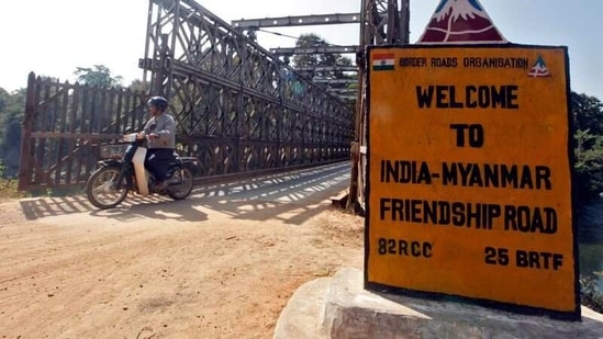 A man rides his motorised two-wheeler across the Indo-Myanmar border bridge at the border town of Moreh, in the northeastern Indian state of Manipur, on January 25, 2012. (Reuters)