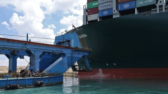 A handout picture released by the Suez Canal Authority shows the Ever Given lodged sideways.(AFP) A handout picture released by the Suez Canal Authority shows the Ever Given lodged sideways.(AFP)