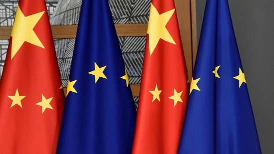 FILE - In this file photo dated Tuesday, Dec. 17, 2019, EU and Chinese flags at the Europa building in Brussels. China’s European Union envoy on Wednesday Jan. 27, 2021, is urging the 27-nation European bloc to deepen its ties with his country even further and says he hopes the EU’s desire for “strategic autonomy” will guide its foreign policy in the future .(John Thys/FILE via AP)(AP)