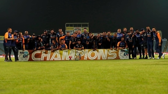 Team India poses with the winners trophy after clinching the series 2-1.(Twitter -Virat Kohli)