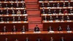 China's President Xi Jinping (C) applauds with other leaders and delegates after the result of the vote on changes to Hong Kong's election system was announced.(AFP) China's President Xi Jinping (C) applauds with other leaders and delegates after the result of the vote on changes to Hong Kong's election system was announced.(AFP)