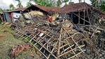 A woman tries to gather her belongings from her damaged house in Kakdwip, Sunderbans.(HT Photo) A woman tries to gather her belongings from her damaged house in Kakdwip, Sunderbans.(HT Photo)