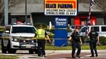 Virginia Beach police put up police tape across Pacific Ave. at the Oceanfront on Saturday, March 27, 2021, morning after a fatal shooting the night before in Virginia Beach, Va. A pair of overnight fatal shootings along the beachfront in Virginia Beach wounded several people in a scene described by authorities on Saturday as “very chaotic.” (Stephen Katz /The Virginian-Pilot via AP)(AP) Virginia Beach police put up police tape across Pacific Ave. at the Oceanfront on Saturday, March 27, 2021, morning after a fatal shooting the night before in Virginia Beach, Va. A pair of overnight fatal shootings along the beachfront in Virginia Beach wounded several people in a scene described by authorities on Saturday as “very chaotic.” (Stephen Katz /The Virginian-Pilot via AP)(AP)