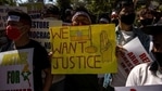 Myanmar citizens living in India hold placards during a protest against the military coup in Myanmar, in New Delhi.(Reuters) Myanmar citizens living in India hold placards during a protest against the military coup in Myanmar, in New Delhi.(Reuters)
