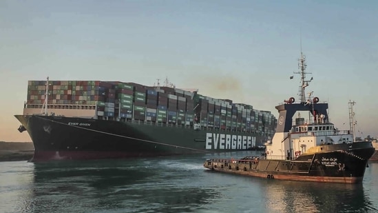The Ever Given container ship, being pulled by one of the Suez Canal tugboats, on March 29. The 400-metre long Ever Given got jammed diagonally across a southern section of the canal in high winds on March 23, halting traffic on the shortest shipping route between Europe and Asia.(Suez Canal Authority via AP)