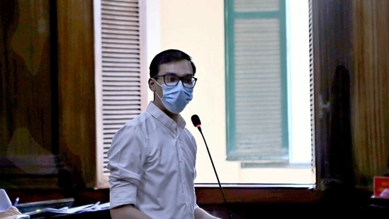 Vietnam Airlines flight attendant Duong Tan Hau, addresses the court before being found guilty of violating Covid-19 quarantine rules and handed a two year suspended prison term in Ho Chi Minh City, Vietnam.(Reuters)