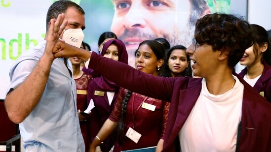 Congress leader Rahul Gandhi interacts with a student at St. Theresa College, in Kochi on Monday (ANI Photo)